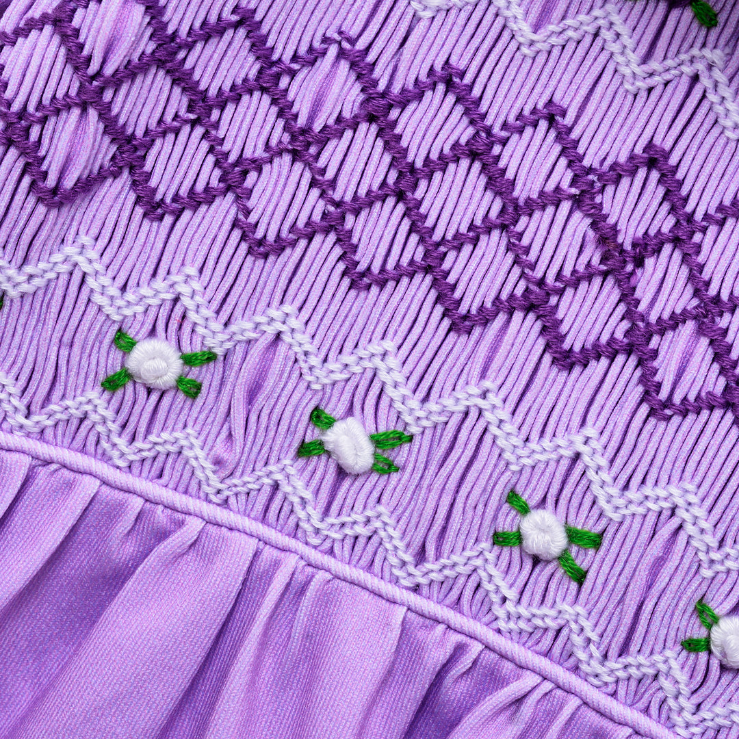 smocked baby sleepsuit lilac