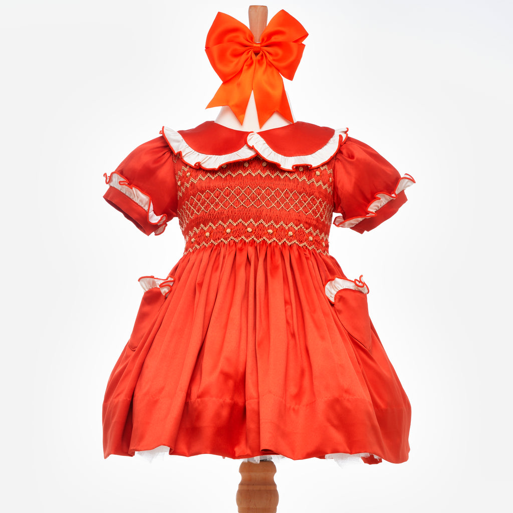 smocked orange baby dress