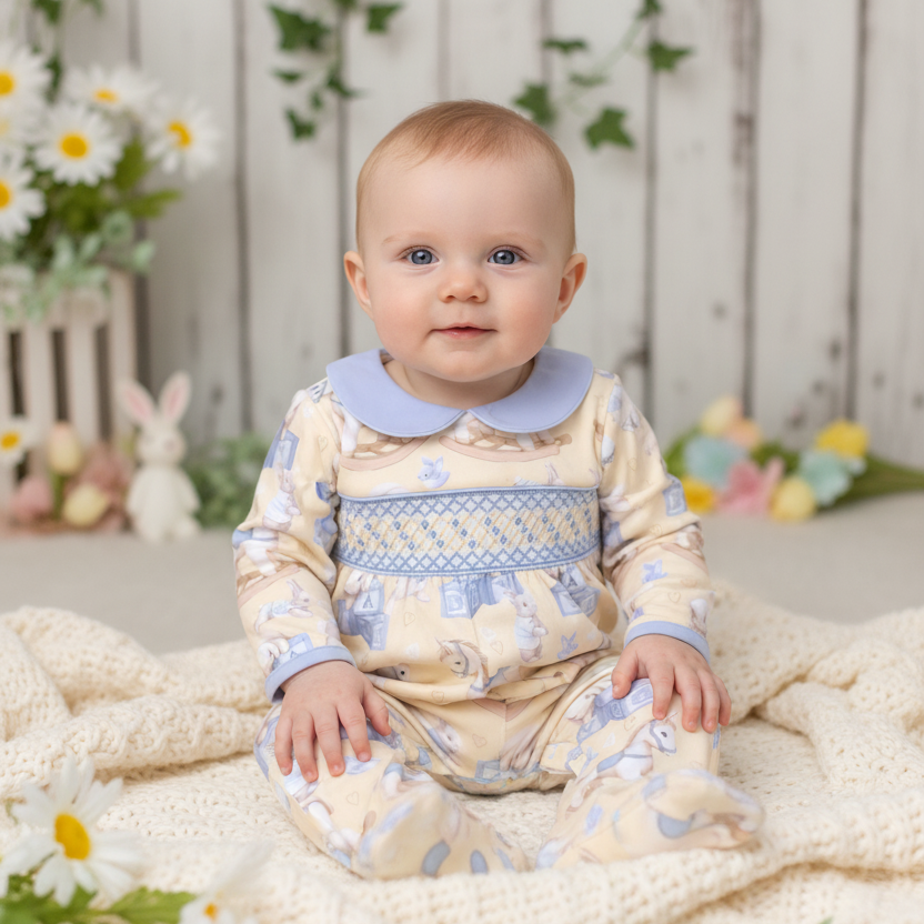 handmade smocked baby sleepsuit with geometric embroidery bunny theme