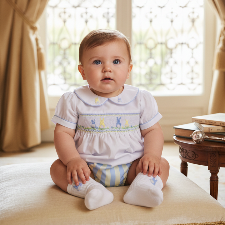white and blue baby boys smocked outfit featuring bunnies hand embroidery hand smocking 