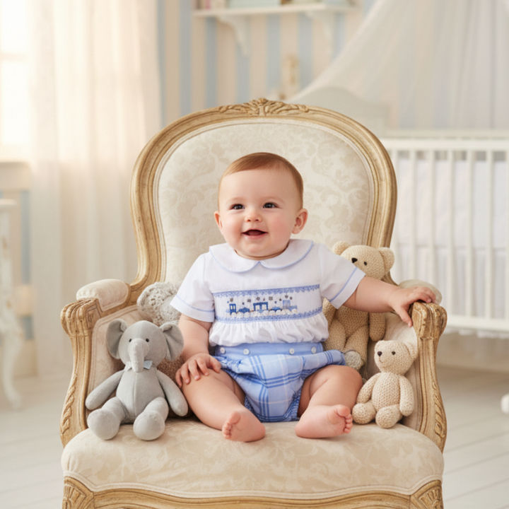 Baby sitting on a decorative chair with teddy bears and blocks in a nursery.